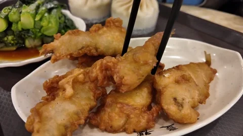 Fried Delicacies Picked with Chopsticks Close Up Stock Footage 259253574