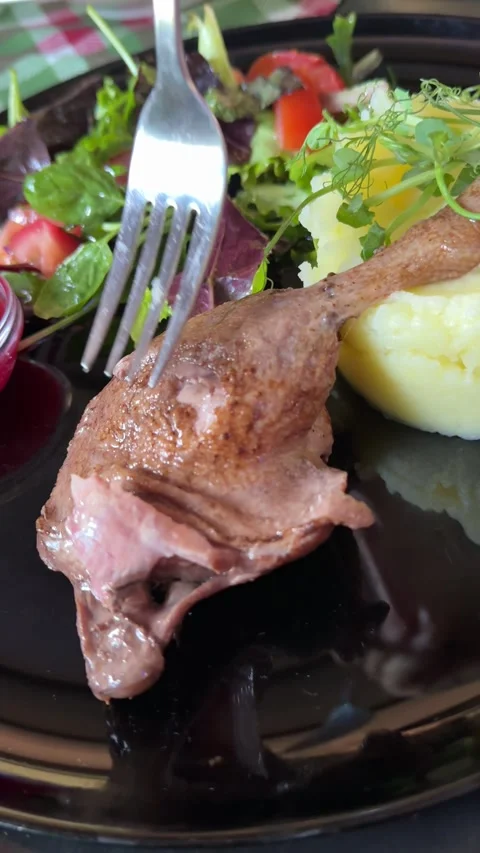 Fried Duck Meat With Mashed Potato and Vegetable Decoration Served on White Video stock 314466421