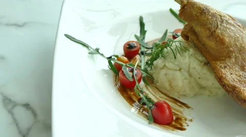 Fried duck with potato in white plate Stock Footage