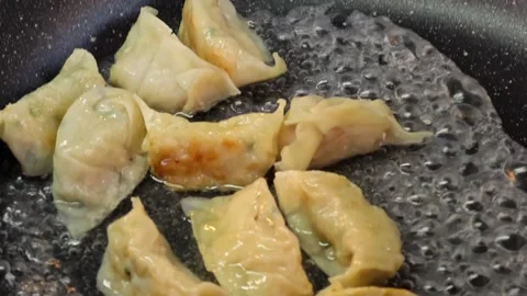 Fried dumplings filled with leeks Stock Footage 304593077