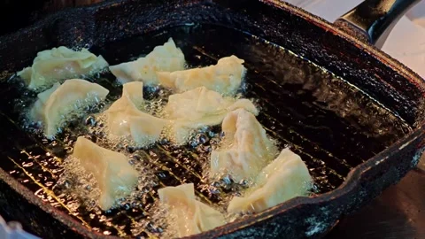 Fried dumplings filled with leeks Stock Footage 304593087