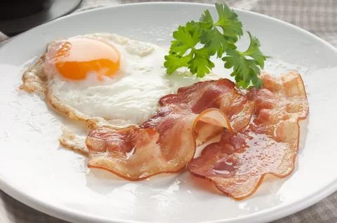 Fried egg and bacon Stock Photos