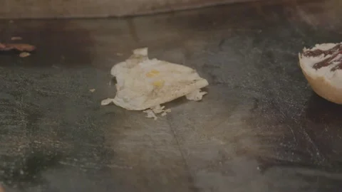 Fried Egg and Bread Roll Cooking on Griddle at Sydney Market Food Stall Stock Footage 345715522