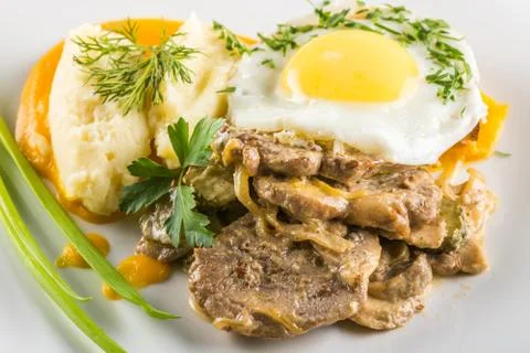 Fried egg and meat Stock Photos