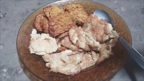 Fried Egg and Tempeh on Brown Glass Plate | Simple Indonesian Meal Stock Footage 296856293