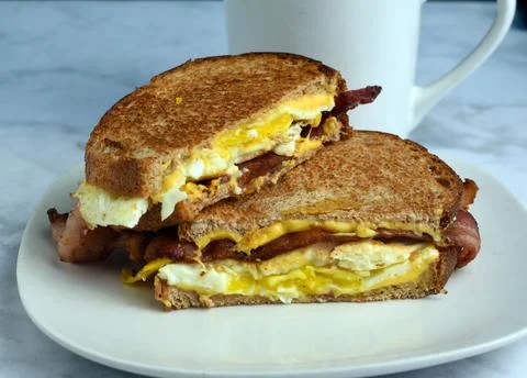 Fried egg bacon breakfast  melt  sandwich Stock Photos