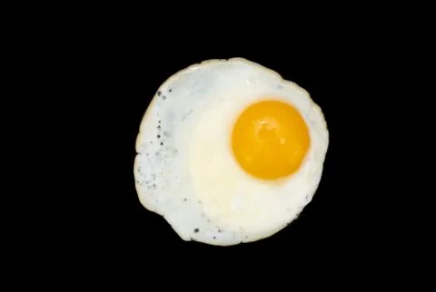 Fried egg on a black Stock Photos