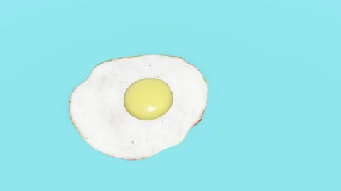 Fried Egg on Blue Background Video stock 320828053