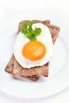 Fried egg on bread Stock Photos