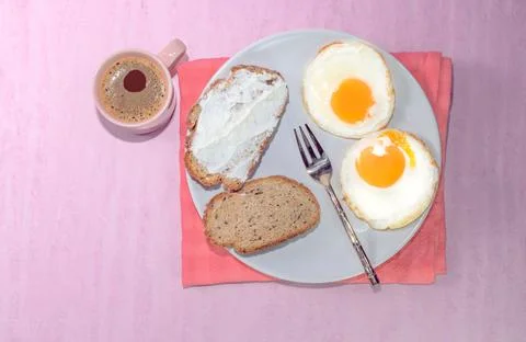 Fried egg bread slice in plate have espresso coffee Stock Photos