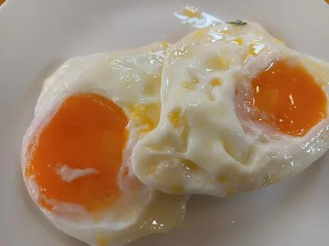 Fried egg. Breakfast dish to start a day. Stock Photos