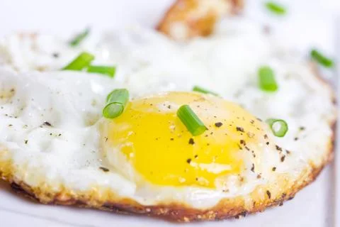 Fried egg with chives Stock Photos