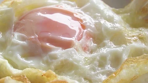 Fried egg is a cooked Stock Footage 232390306