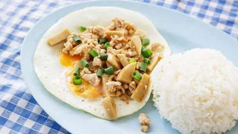 Fried egg with cooked rice. Stock Photos