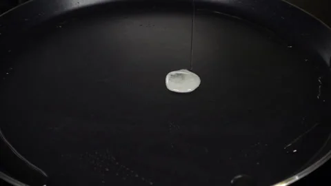 Fried egg cooking, slow motion Stock Footage 86931753