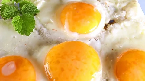 Fried egg eggs rotating texture pattern closeup footage Stock Footage 97233010