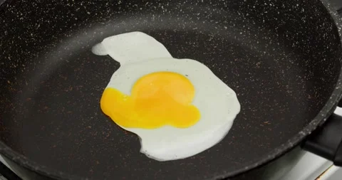 Fried egg Stock Footage 235442878