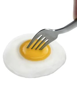 Fried egg on fork isolated on white background Stock Photos