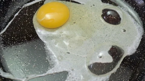 Fried egg on frying pan Stock Footage 52155162