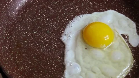 Fried egg in a frying pan Stock Footage 150406476