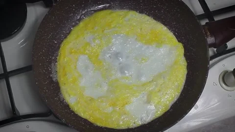 Fried egg in a frying pan Stock Footage 150406479