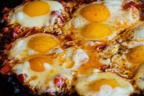 Fried egg on frying pan. Fried eggs in a frying pan. Stock Photos