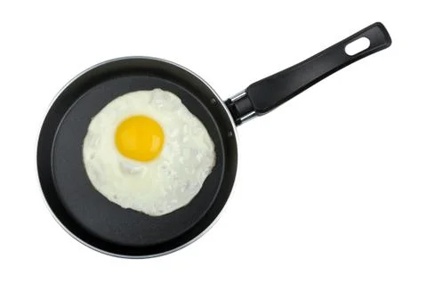 Fried egg in a frying pan Stock Photos