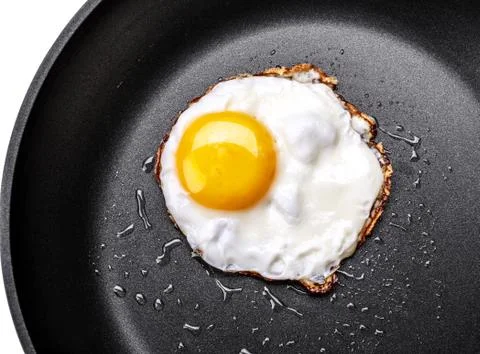 Fried egg in a frying pan Stock Photos