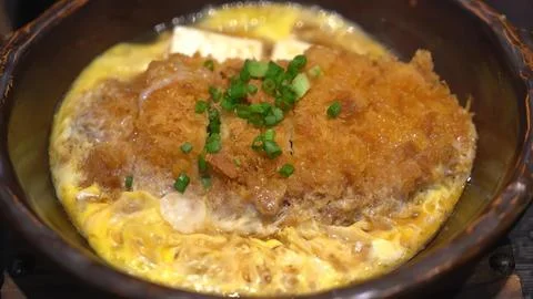 Fried egg with ground meat and herbs in a pan Stock Photos