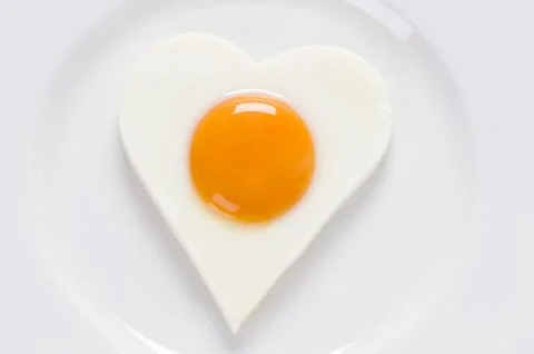 Fried egg in a heart shape Stock Photos