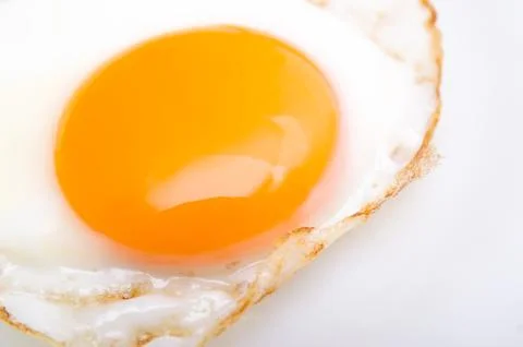 Fried egg isolated on dish Stock Photos