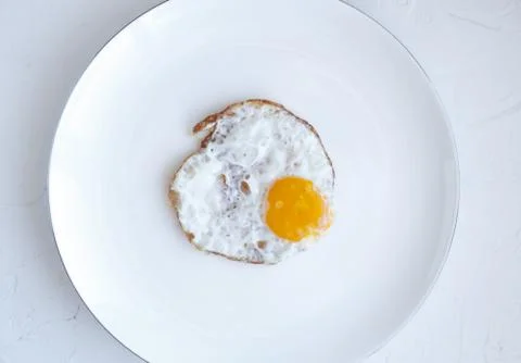Fried egg isolated on white background, top view Stock Photos