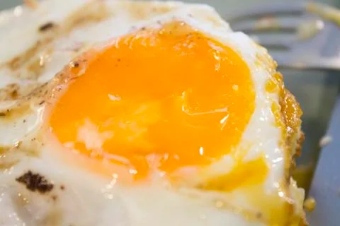 Fried egg in macro Stock Photos