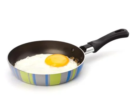 Fried egg on pan Stock Photos