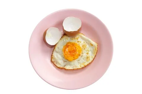 Fried egg in pink dish isolate on white background. Stock Photos