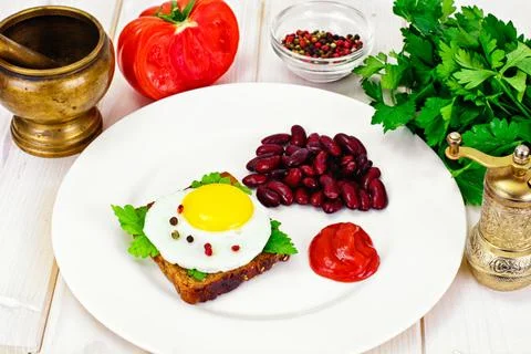 Fried Egg with Red Beans Stock Photos