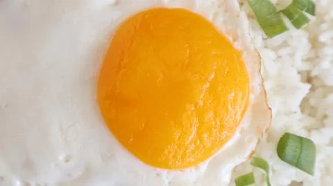 Fried egg rice. breakfast fried egg sunny side rice on a plate, isolated on.. Stock Photos
