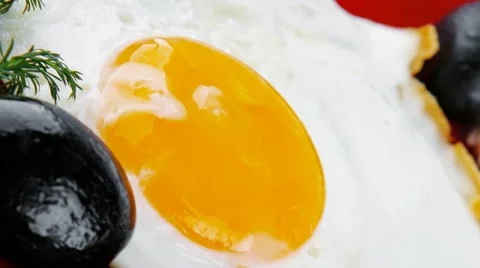 Fried egg served on red dish Stock Footage 55785261