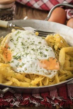 Fried egg served with yellow beans. Stock Photos