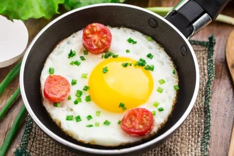 Fried egg in a small pan Stock Photos