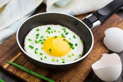 Fried egg in a small pan Stock Photos