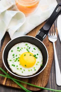 Fried egg in a small pan Stock Photos