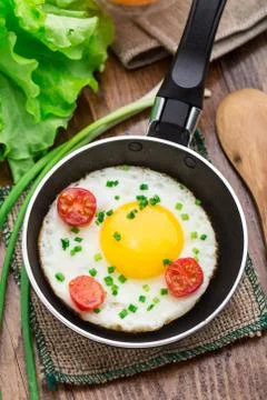 Fried egg in a small pan Stock Photos