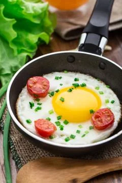 Fried egg in a small pan Stock Photos