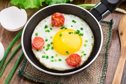 Fried egg in a small pan Stock Photos