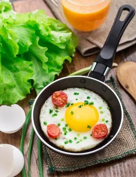 Fried egg in a small pan Stock Photos