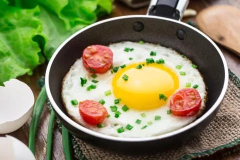 Fried egg in a small pan Stock Photos