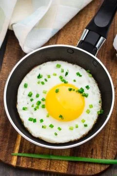 Fried egg in a small pan Stock Photos