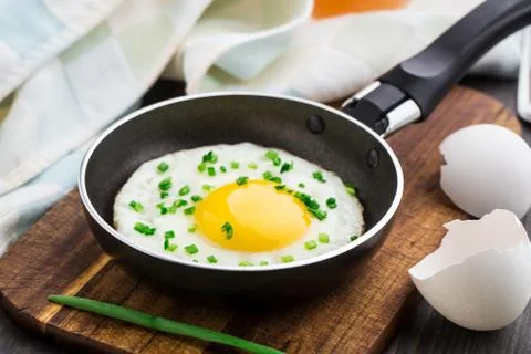 Fried egg in a small pan Stock Photos