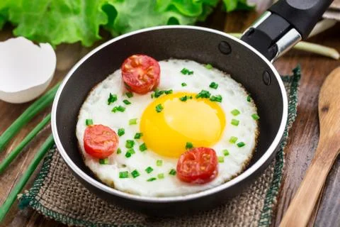 Fried egg in a small pan Stock Photos
